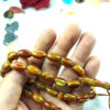 تسبیح رزینی صندل اسلامی ساخته شده با 33 مهره تسبیح تیره