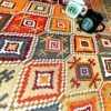 رومیزی با الهام از گلیم ایرانی با پارچه پی‌وی‌سی