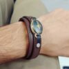 دستبند چرمی مردانه با نگین حدید اصل و طبیعی فروهر، قاب اطراف نقره